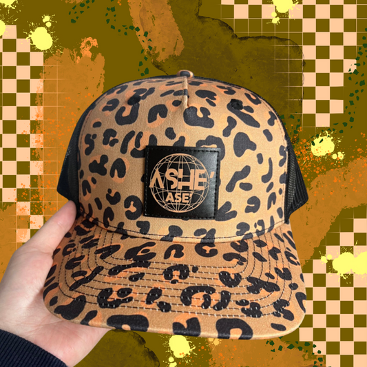 Ase’ Ashe’ Ase’ Leopard Trucker Hat
